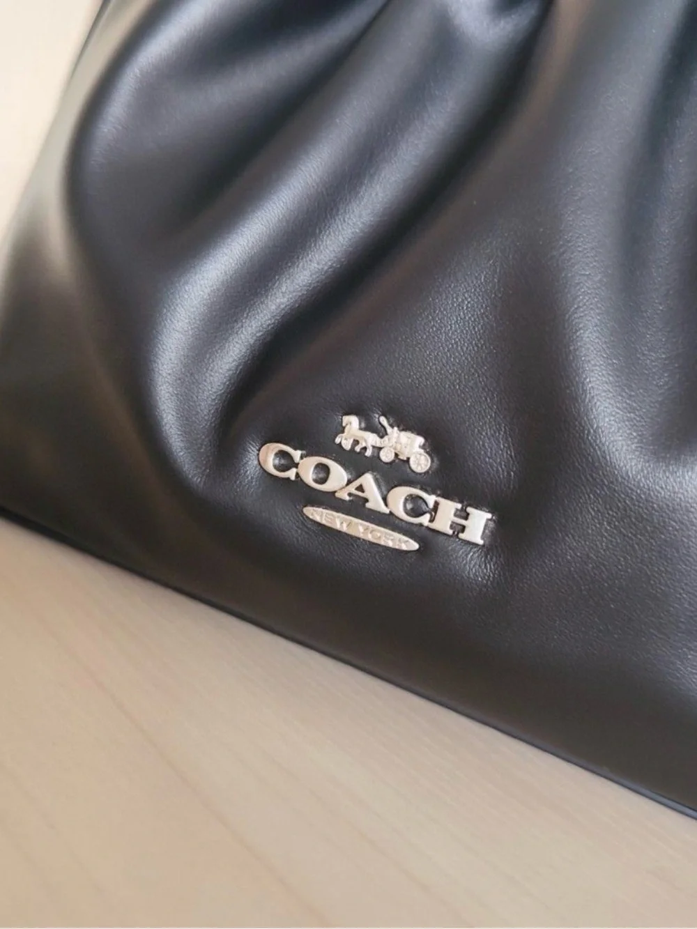 Coach sleek black